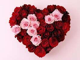 Heart-shaped arrangement of red and pink roses for special occasions photo
