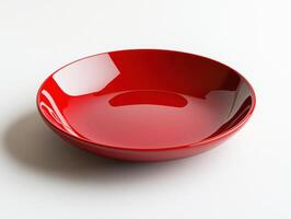 Bright red ceramic bowl on a clean surface in a minimal setting photo