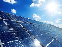Solar panels absorb sunlight on a clear day with blue sky photo