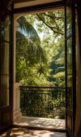 Tranquil view of lush tropical garden from open balcony window showcasing abundant greenery photo