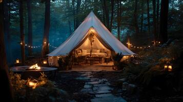 Idyllic glamping experience inside a comfortable tent surrounded by a dark forest at night photo