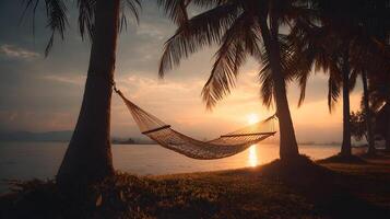 Hammock swaying gently between palms at sunset invites relaxation and dreamlike serenity photo