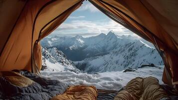 Spectacular mountain views from inside a cozy tent during winter with snowy peaks photo