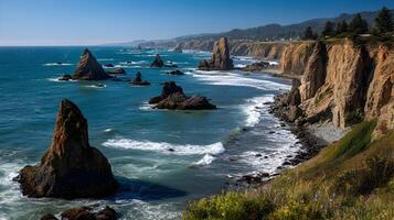 Scenic coastline landscape view with towering rocks and cliffs, blue ocean water and sky photo