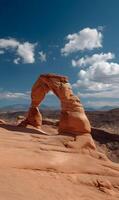 Majestic Delicate Arch standing tall against the blue sky in Arches National Park Utah photo