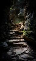 Sunlit stone staircase through a rugged natural canyon with mossy rocks and walls along the path photo
