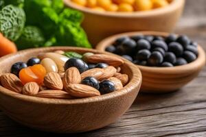 Wooden bowls overflowing with healthy nuts, berries, and dried fruit on rustic table photo