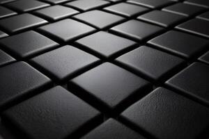 Black square tiles creating textured geometric pattern photo