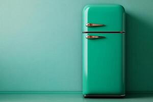 Turquoise retro refrigerator standing in a room with matching walls and floor photo