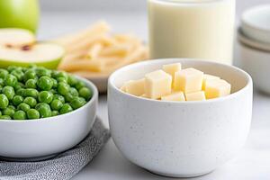 Preparing ingredients for cooking with cheese, peas and pasta photo