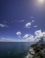 Aerial view of Salvador Bahia Brazil featuring the Bay of All Saints under a blue sky photo