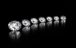 Group of diamonds placed on glossy background 3d Rendering photo