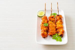 grilled chicken skewer with herbs and spices - street food style photo