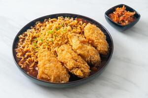 Korean instant noodles with fried chicken or Fried chicken ramyeon - Asian food style photo