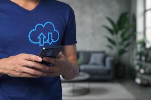 Man Using Smartphone for Cloud Data Download and Upload Processes photo