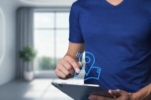 Person Using Tablet with Location Pin Icon in Modern Room Setting photo