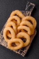 Onion rings or squid rings fries crispy with sauce photo