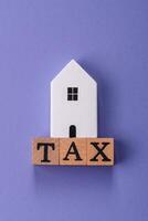Tax on real estate, property, car or business. photo