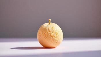 minimalist food photography of a single sugar blown fruit with thin candy shell, soft pastel gradient background photo