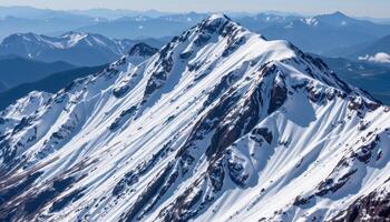 a steep mountain spine with snow covered ridges and sharp outcroppings. photo