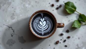 minimalist food photography of a charcoal latte in a handmade mug with activated charcoal foam art, soft dove gray background photo