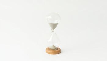 A decorative hourglass on wooden base symbolizes passage of time, adding elegance to any space photo