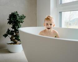 In a calm, sunlit bathroom, a young child enjoys his bath, splashing water and giggling as rubber ducks float by, the soft echo of his laughter bouncing off the tiled walls. photo