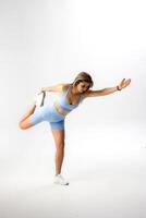 Fitness enthusiast engaged in an intense workout routine in minimalistic studio setting photo