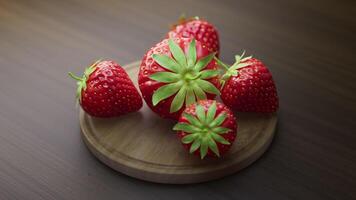 Looping animation around a composition of strawberry lying on a wooden board. Loop motion. Defocus. video