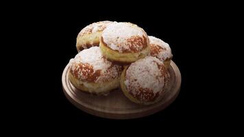 Looping animation around a composition of European classic donuts lying on a wooden board. Loop motion. Alpha Channel. Close-up. video