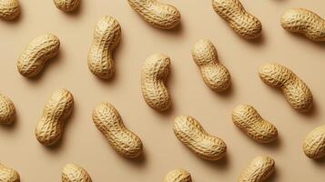 Whole peanuts in shell on beige background, pattern photo
