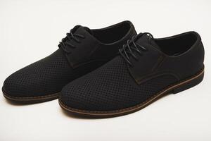 Cobalt synthetic lightweight gentlemen's desert boots on a white studio background. Airflow vents for ventilation. photo