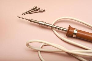 A classic soldering iron adorned with a silver point photo