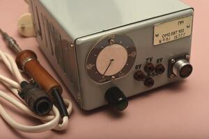 soldering station. An old soldering iron with a silver tip. photo