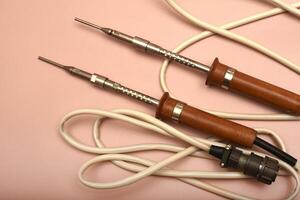 A historic soldering instrument with a silver head photo