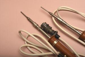 A weathered soldering device boasting a silver end photo