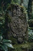 Ancient mayan stone carving covered in moss in a lush jungle setting photo