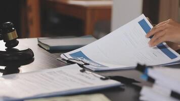 A person is reading a document on a desk video