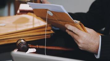 A judge's gavel is used to open a file video
