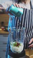 Man add milk to Smoothie Strawberry Kiwi Banana Goji Berry Refreshing and Nutritious video