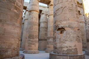 Karnak Temple in Luxor, Egypt. Hieroglyphs and Art on pillars and walls. Temples. pylons. chapels, other buildings in Karnak Temple Complex photo