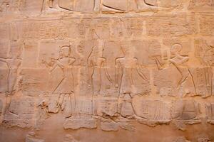 Karnak Temple in Luxor, Egypt. Hieroglyphs and Art on pillars and walls. Temples, pylons, chapels, and other buildings in Karnak Temple. photo