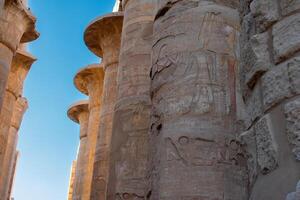 Karnak Temple in Luxor, Egypt. Hieroglyphs and Art on pillars and walls. Temples, pylons, chapels, and other buildings in Karnak Temple Complex . photo