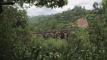 Timelapse of famous iconic landmark Nine Arch Bridge in Ella. Surrounded by lush jungles. Colonial era railway bridge with its nine elegant stone arches.Destination for travelers and watchers alike video