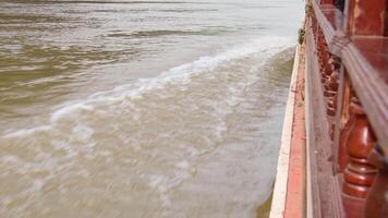 Passengers pov ride on famous slow boat in Laos river Mekong side in southeast asia. Laos to Thailand slow boat trip on scenic river video