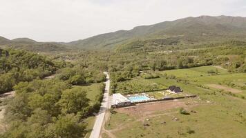 Aerial panorama highway road.Luxury Villa in Kakheti Region. Tranquil Retreat for Travel and Relaxation in the Heart of the Caucasus Mountains.Efficient Space Planning and Functional Architecture. video