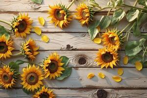 Sunflowers and Petals on Weathered Wooden Surface photo