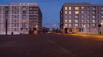 New modern trams passing two apartment buildings in Le Havre, France video