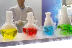 Laboratory tubes with liquids on the table. photo