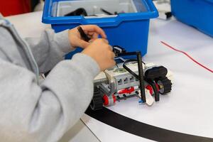 Children are working on model assembly in robotics class photo